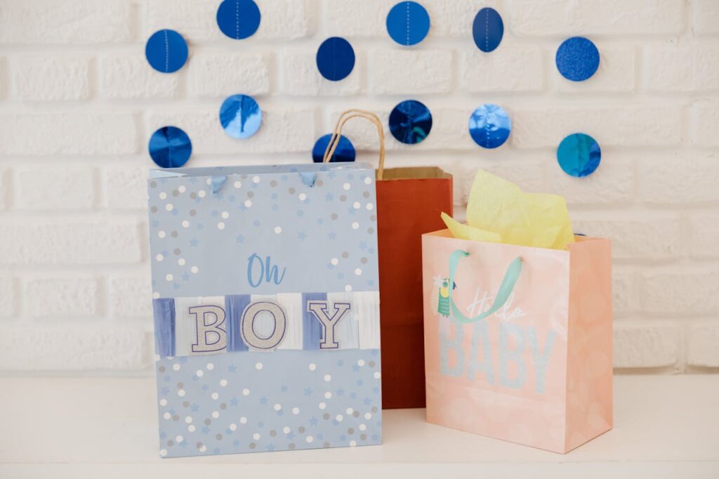 Adorable baby shower gift bags with blue decorations perfect for expecting parents.